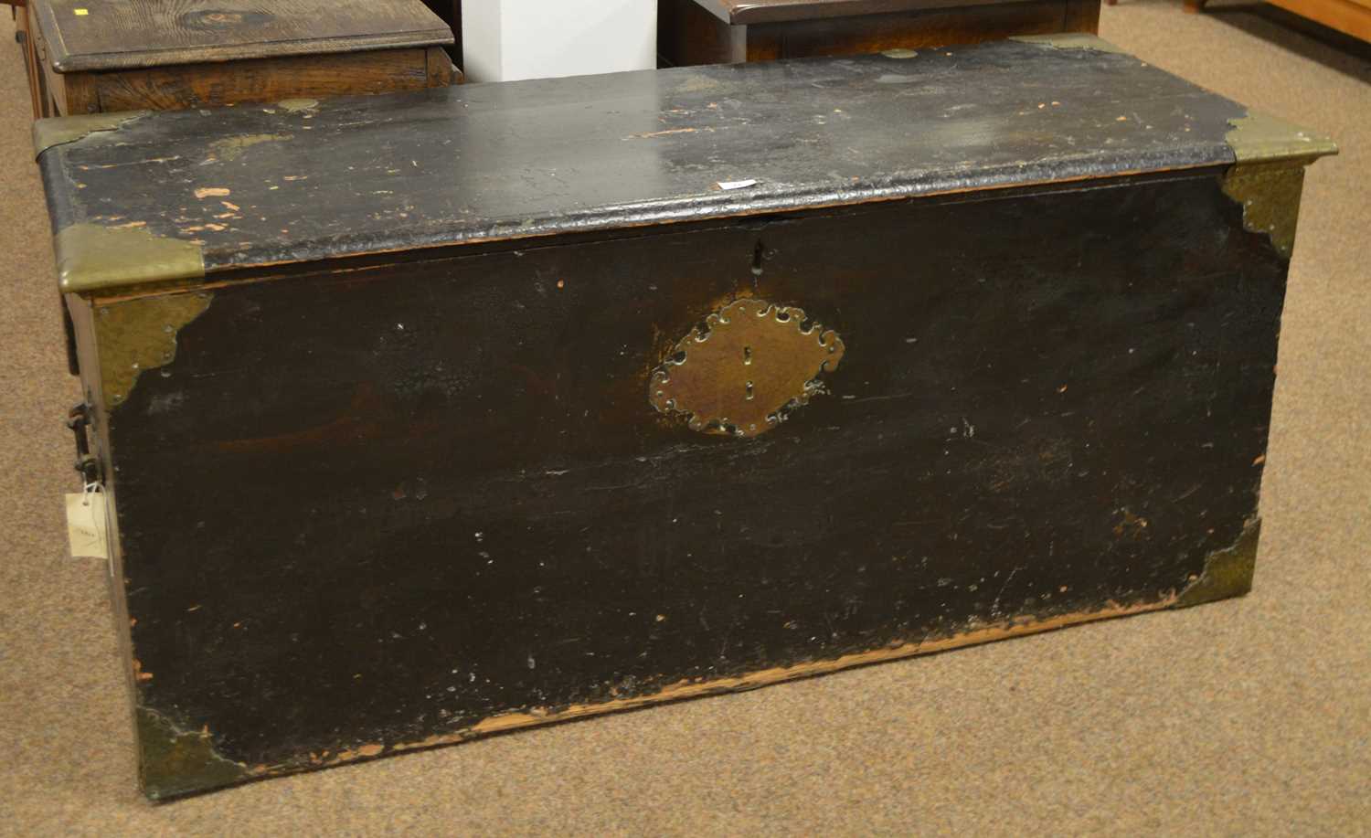 A 19th Century ebonised and brass-bound trunk.