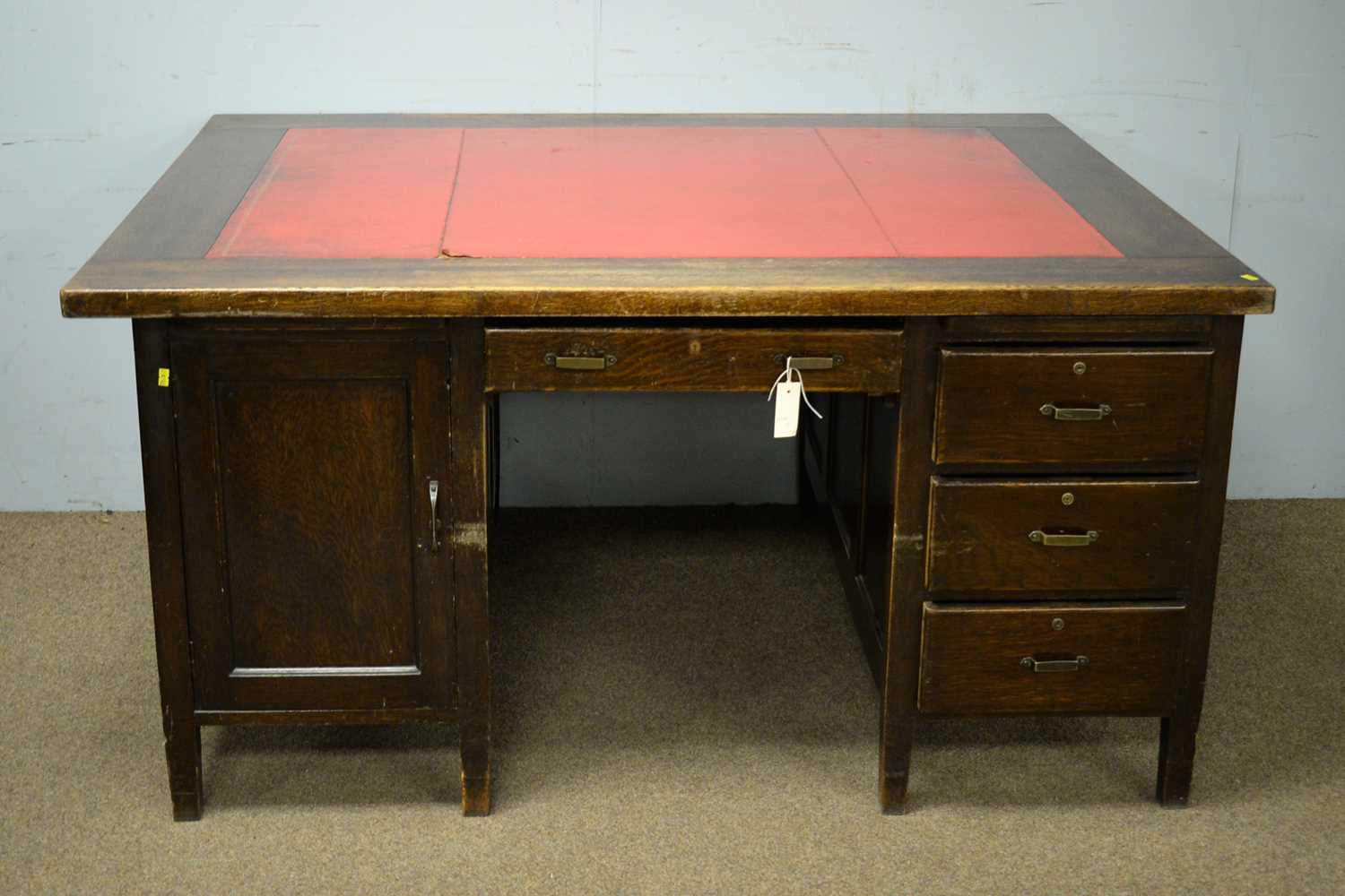 An early 20th Century oak partner's desk.