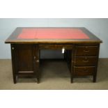 An early 20th Century oak partner's desk.