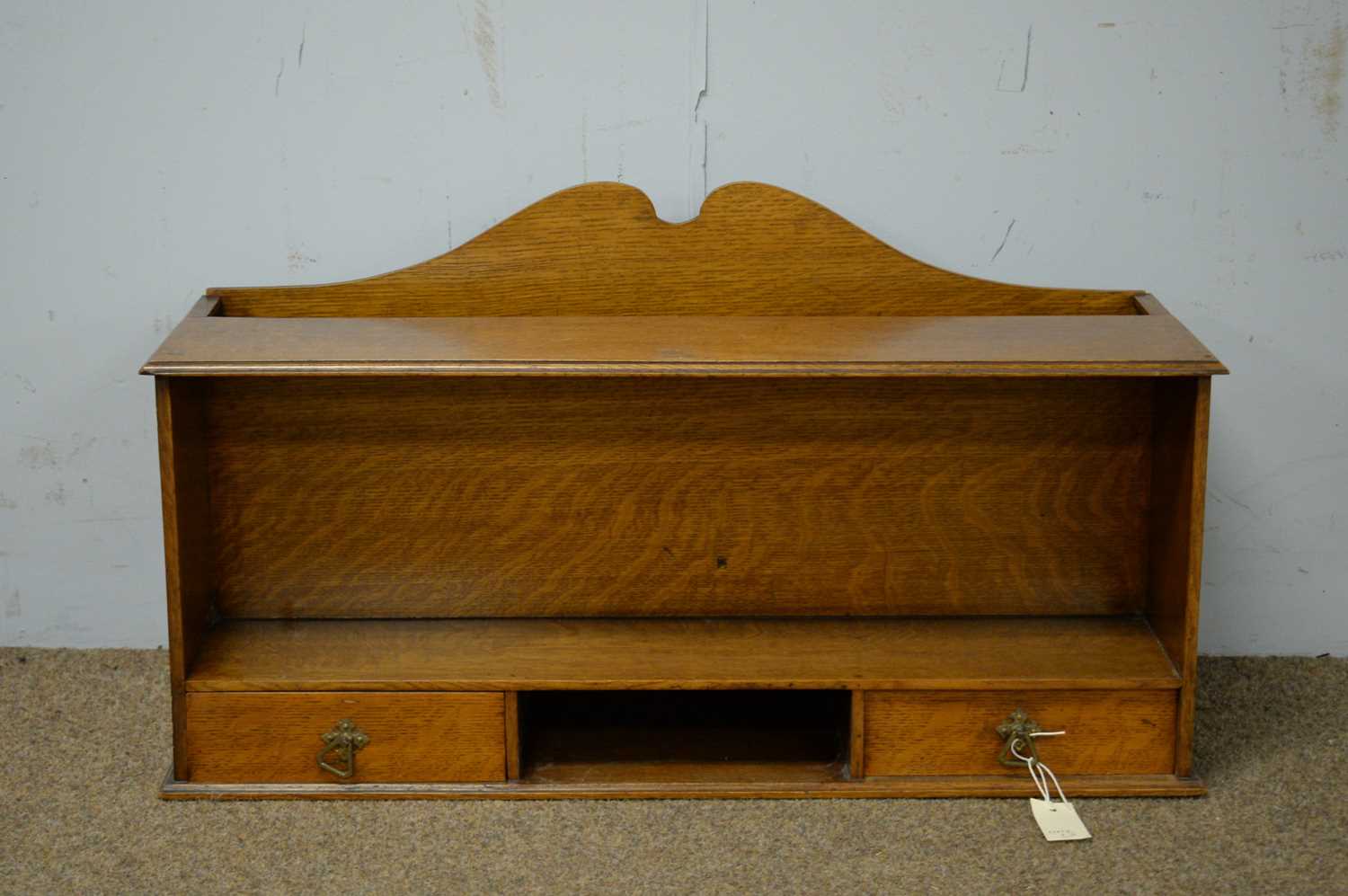 An early 20th Century oak tabletop shelf unit.