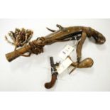 18th Century flintlock pistol and a pocket pistol