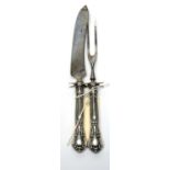 An early 20th Century American Sterling standard silver handled game knife and fork,