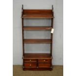 Georgian-style mahogany shelves.