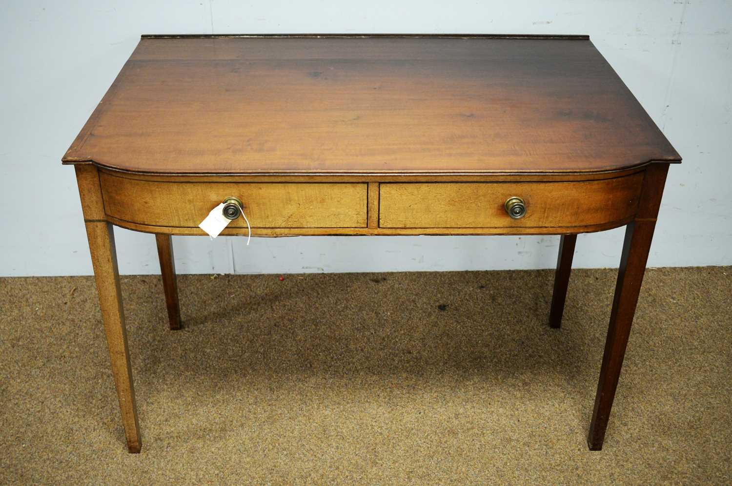 A mahogany bowfront two drawer side table.