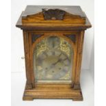 A Late 19th/early 20th century oak mantel clock