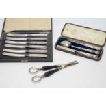 A silver knife and fork and spoon set, and other items
