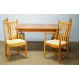 A Troeds teak extending dining table; set of four Ercol dining chairs; and a single 'Siesta' chair.