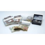 A selection of British and international coins and bank notes.