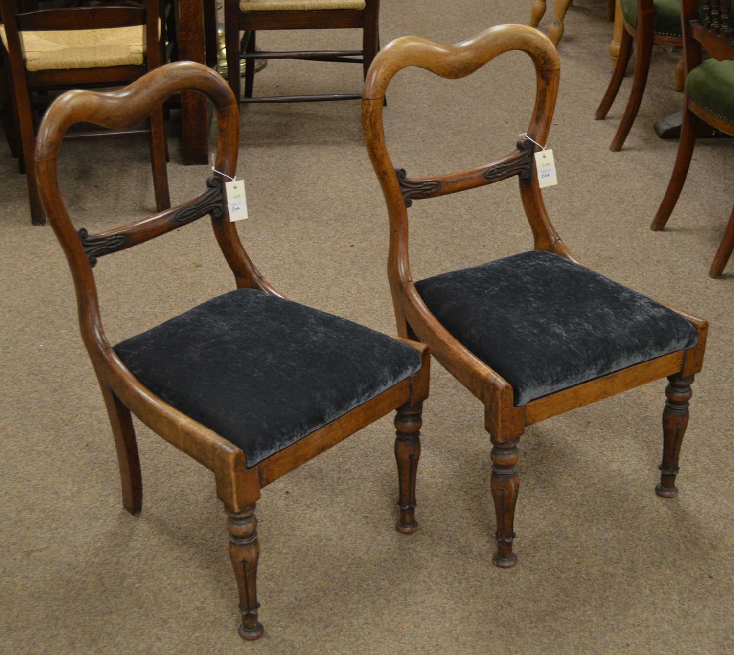 A pair of Victorian rosewood dining chairs.