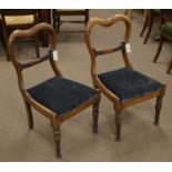 A pair of Victorian rosewood dining chairs.