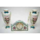 A Minton 'Rose Basket' mantel clock and vases