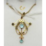 An Edwardian style blue stone and seed pearl pendant,