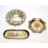 A Victorian silver pin dish, and two dishes