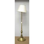 An Indian style gold painted metal lamp standard.