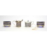 A matched silver condiment set,