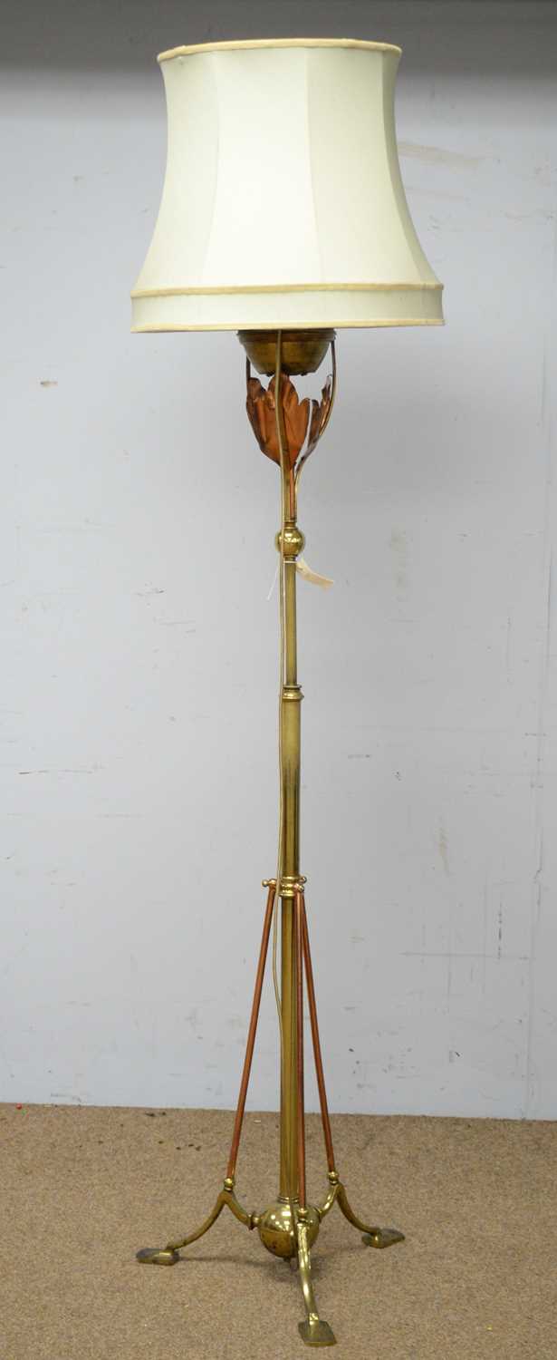 An Arts & Crafts brass oil lamp stand.