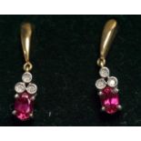 A pair of ruby and diamond drop earrings,