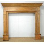 A 20th Century painted softwood fire surround.