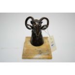 Bronzed sculpture of a rams head