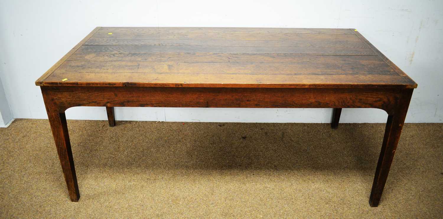 A substantial 18th C style oak plank top dining table.