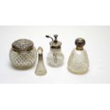 Antique silver mounted cut glass perfume bottles and dressing table jars.