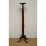 A Georgian style mahogany torchere.