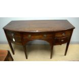 A late George III mahogany bowfront sideboard.