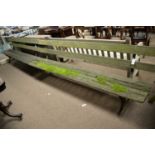 Two vintage cast iron and wooden garden benches.