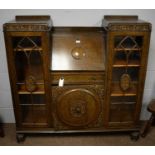 A mid 20th Century carved oak bureau bookcase.