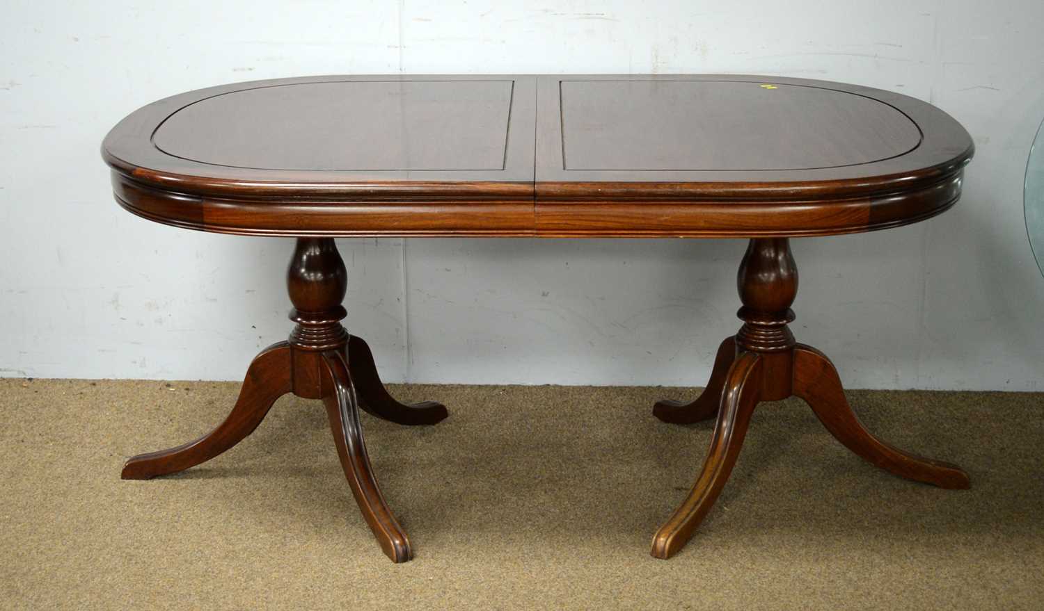 Asian mahogany extending twin-pedestal dining table; and a sideboard.