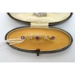 An early 20th Century cultured seed pearl, amethyst and yellow-metal bar brooch