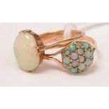 Two opal and yellow-metal rings.