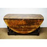 20th Century Titchmarsh & Goodwin oak drop leaf table