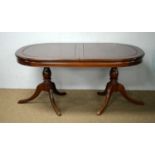 Asian mahogany extending twin-pedestal dining table; and a sideboard.