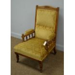 An Edwardian carved oak easy armchair