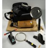 Pair of binoculars, magnifying glasses and other items