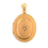 A Victorian yellow metal diamond set locket pendant,