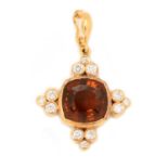 An Imperial Topaz and diamond pendant,