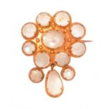 A Victorian moonstone and yellow metal brooch,