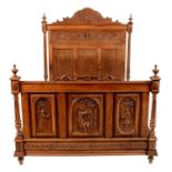 A ornate French carved walnut bed