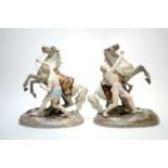 Pair of late 19th/early 20th century German ceramic figure groups of Marley Horses
