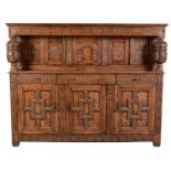 A large and impressive 17th Century style carved oak court cupboard