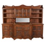 An early 20th Century carved oak breakfront side cabinet