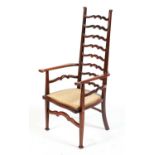 An Arts & Crafts walnut occasional ladder back armchair