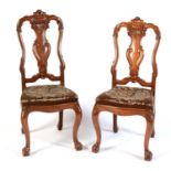 Two carved walnut dining chairs