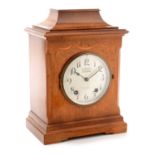 An early 20th Century mantle clock, retailed by T. Gaunt & Co.