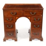 A 19th Century inlaid mahogany kneehole dressing table