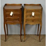 A pair of early 20th Century walnut bedside cabinets