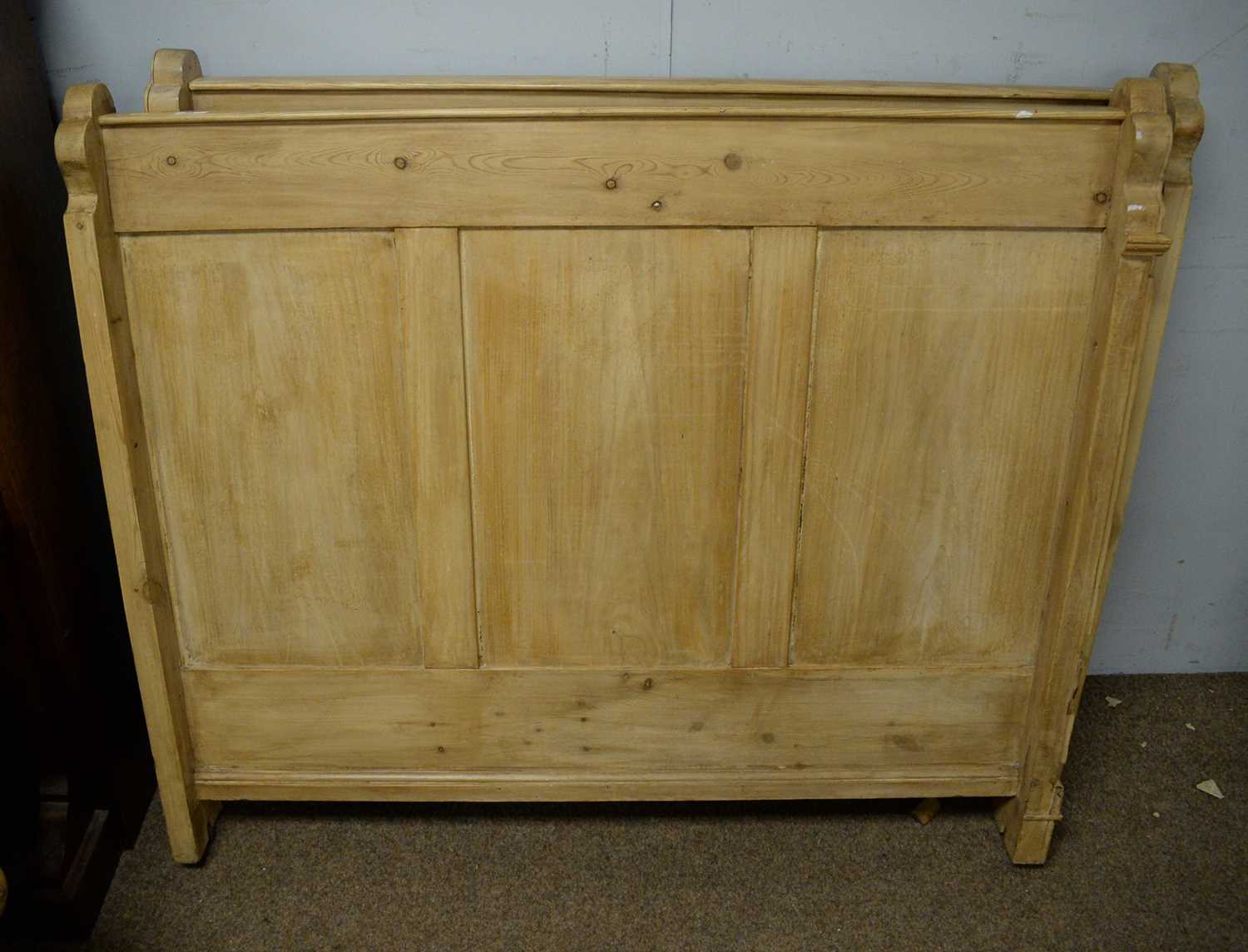 A stripped pine bed