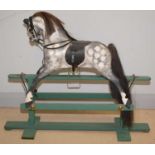 A 20th Century carved greyed apple rocking horse.